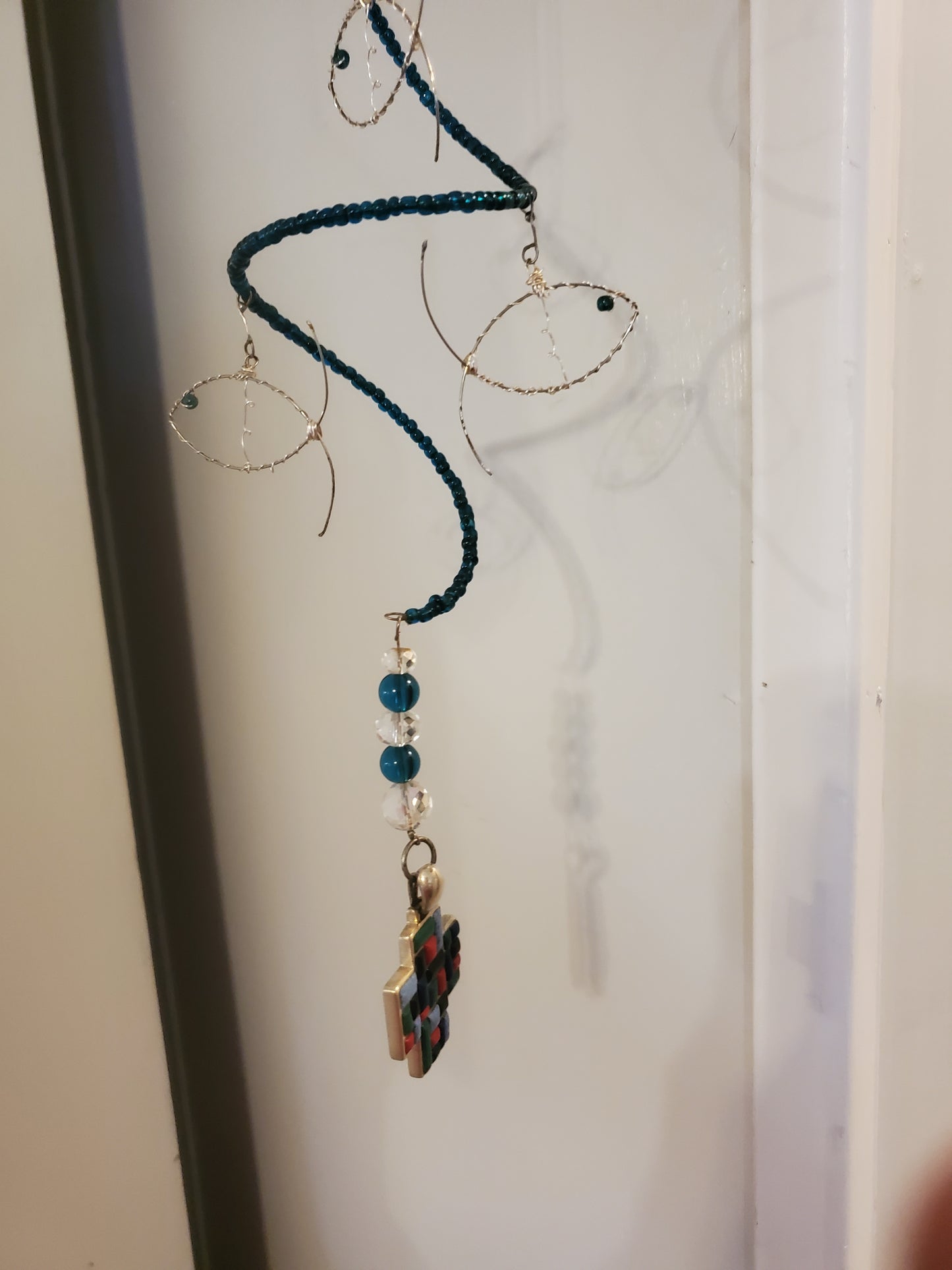 11" Indoor Hanging Fish Spinner hung by a 7" silver chain