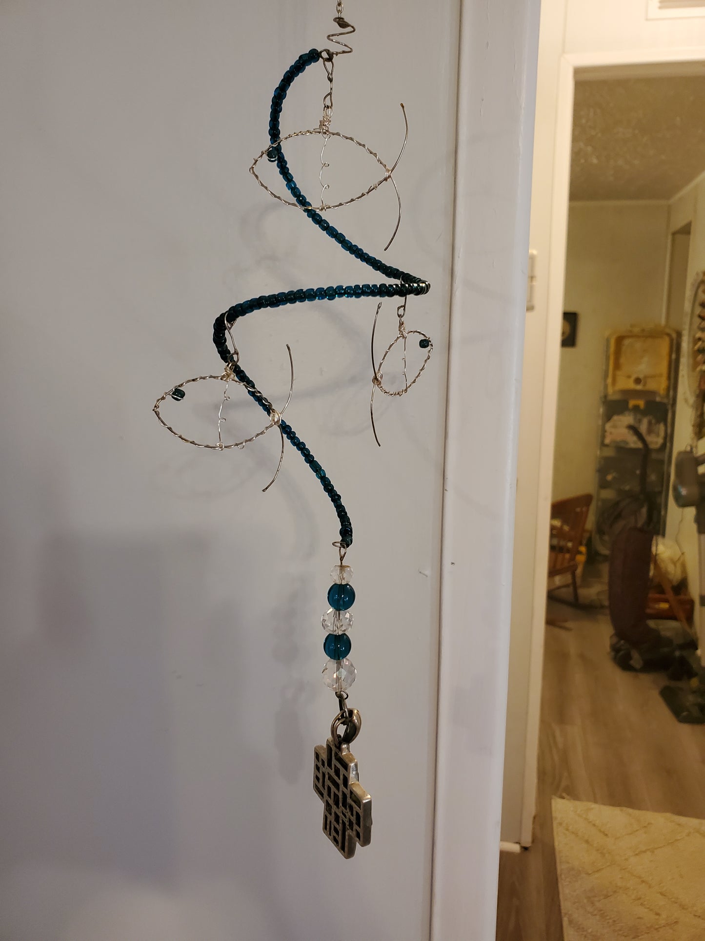 11" Indoor Hanging Fish Spinner hung by a 7" silver chain