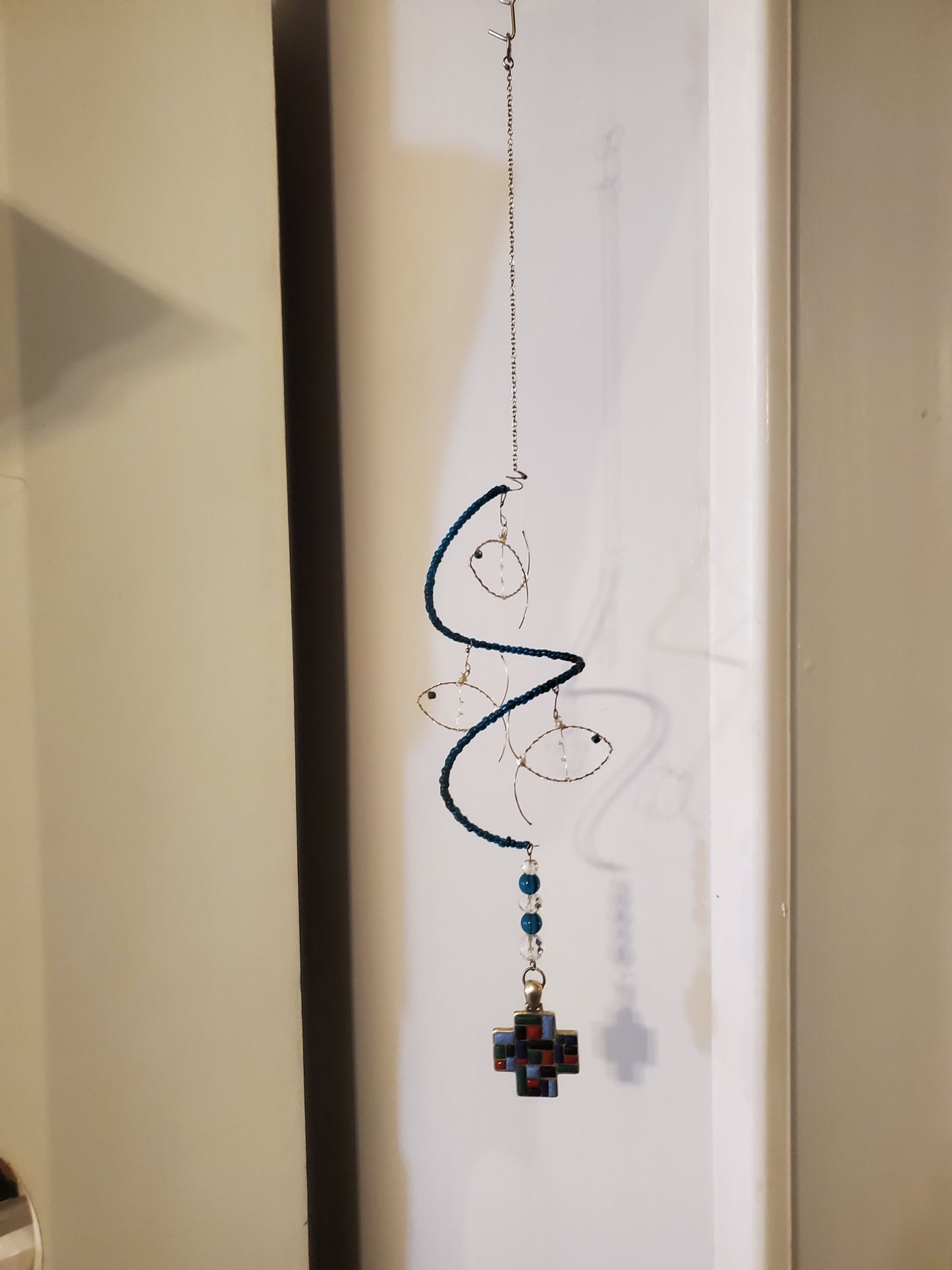 11" Indoor Hanging Fish Spinner hung by a 7" silver chain
