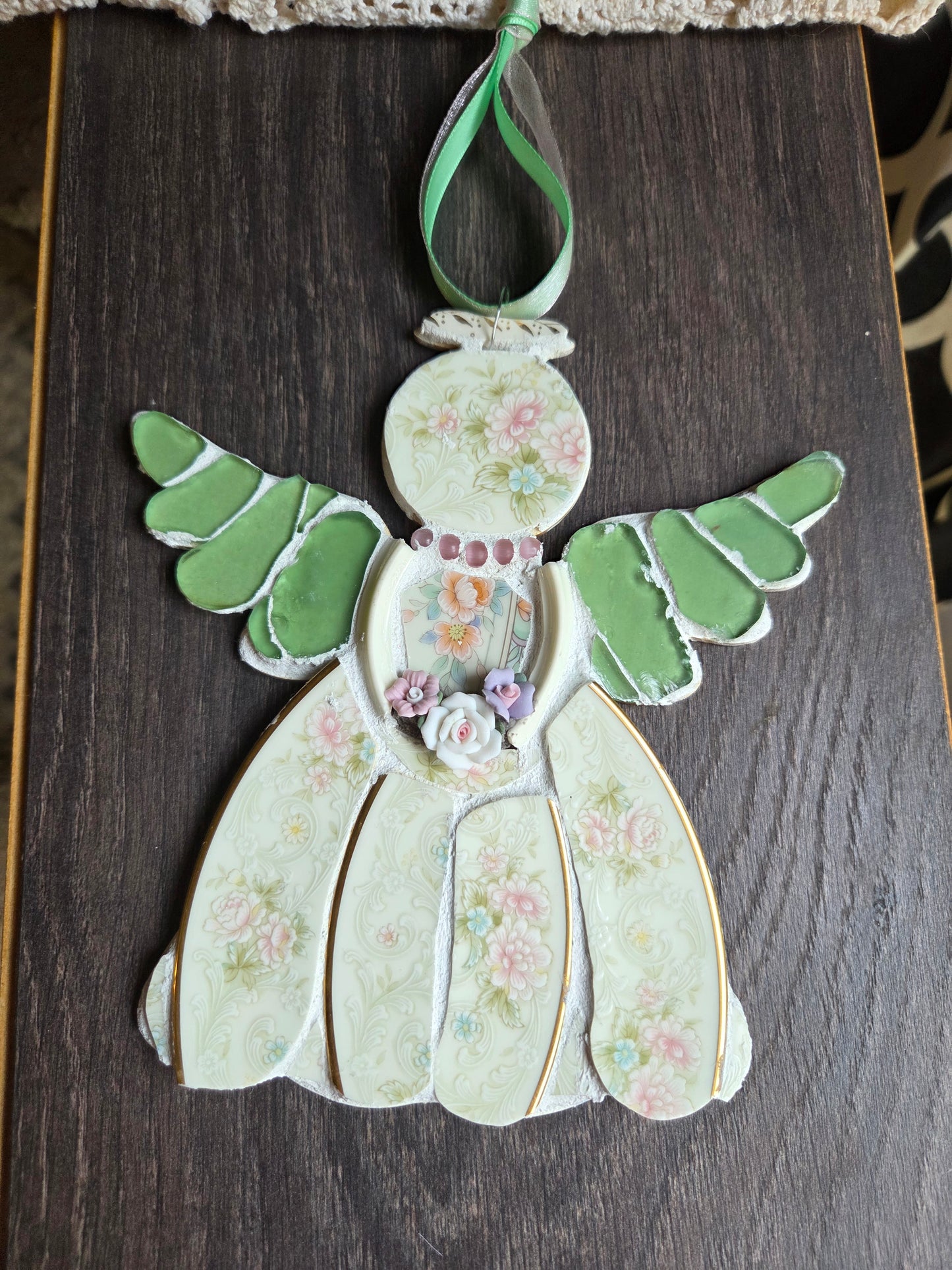 Green and pink mosaic angel