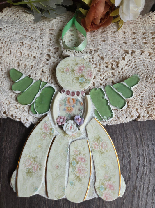 Green and pink mosaic angel